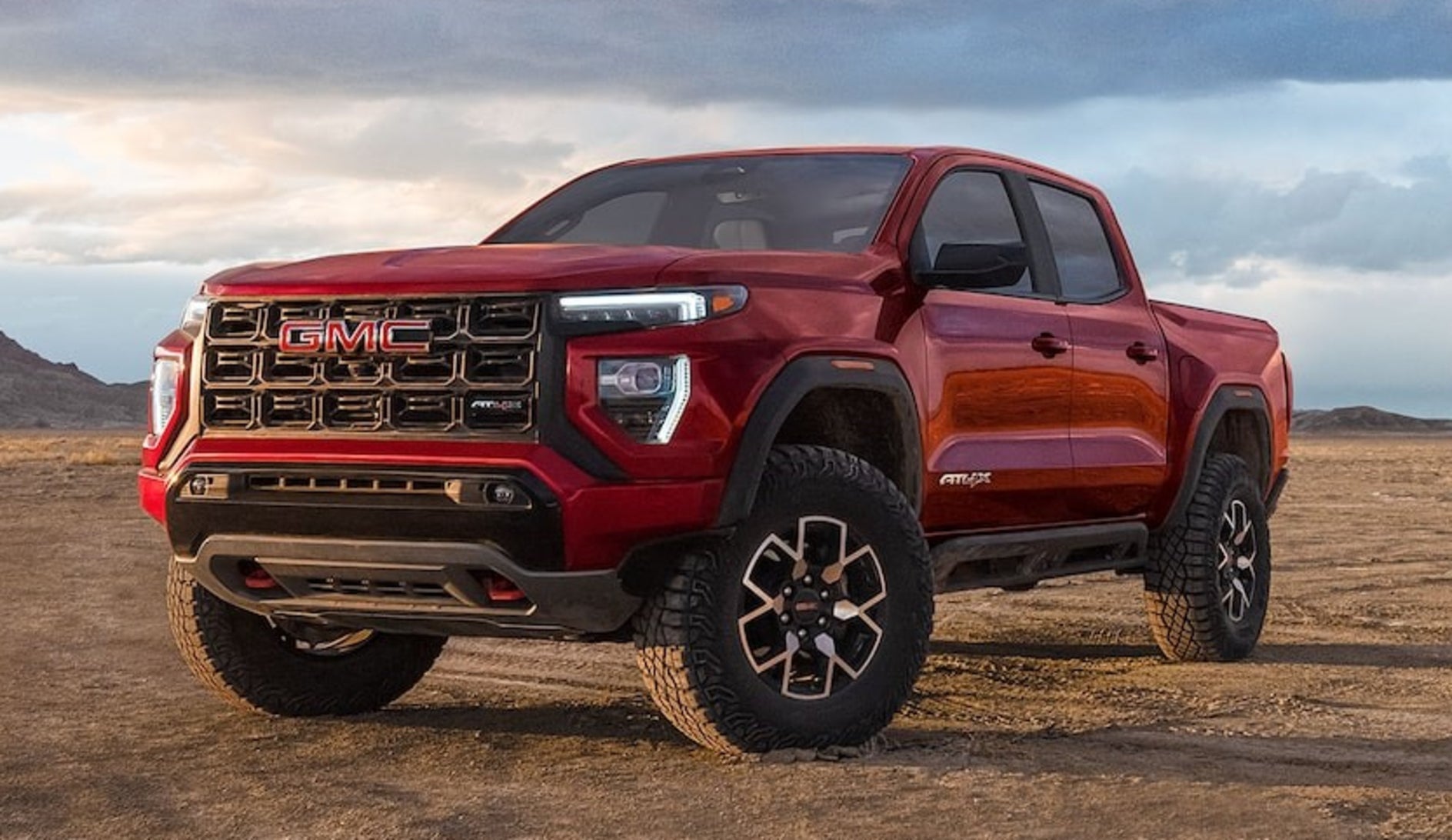 Red 2026 GMC Canyon parked in the desert
