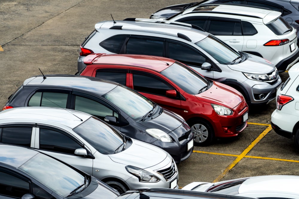 A row of used SUVs in a parking lot.